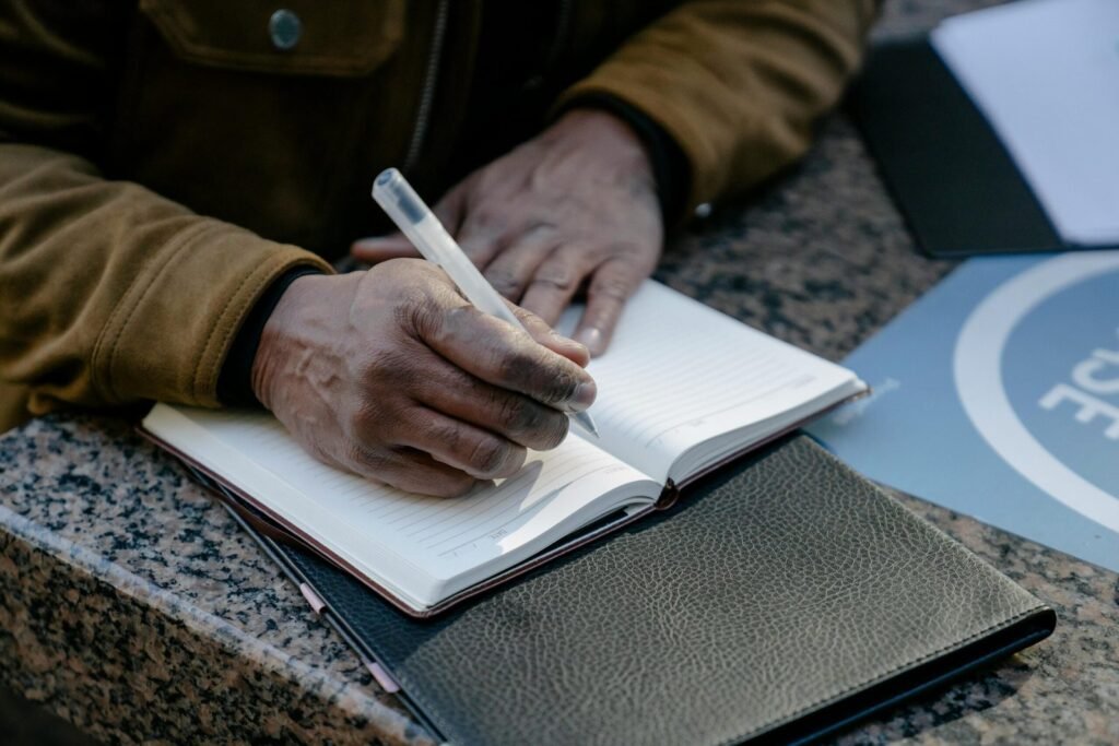 Are you a plotter? Writer planning story with notebooks, charts, and writing tools